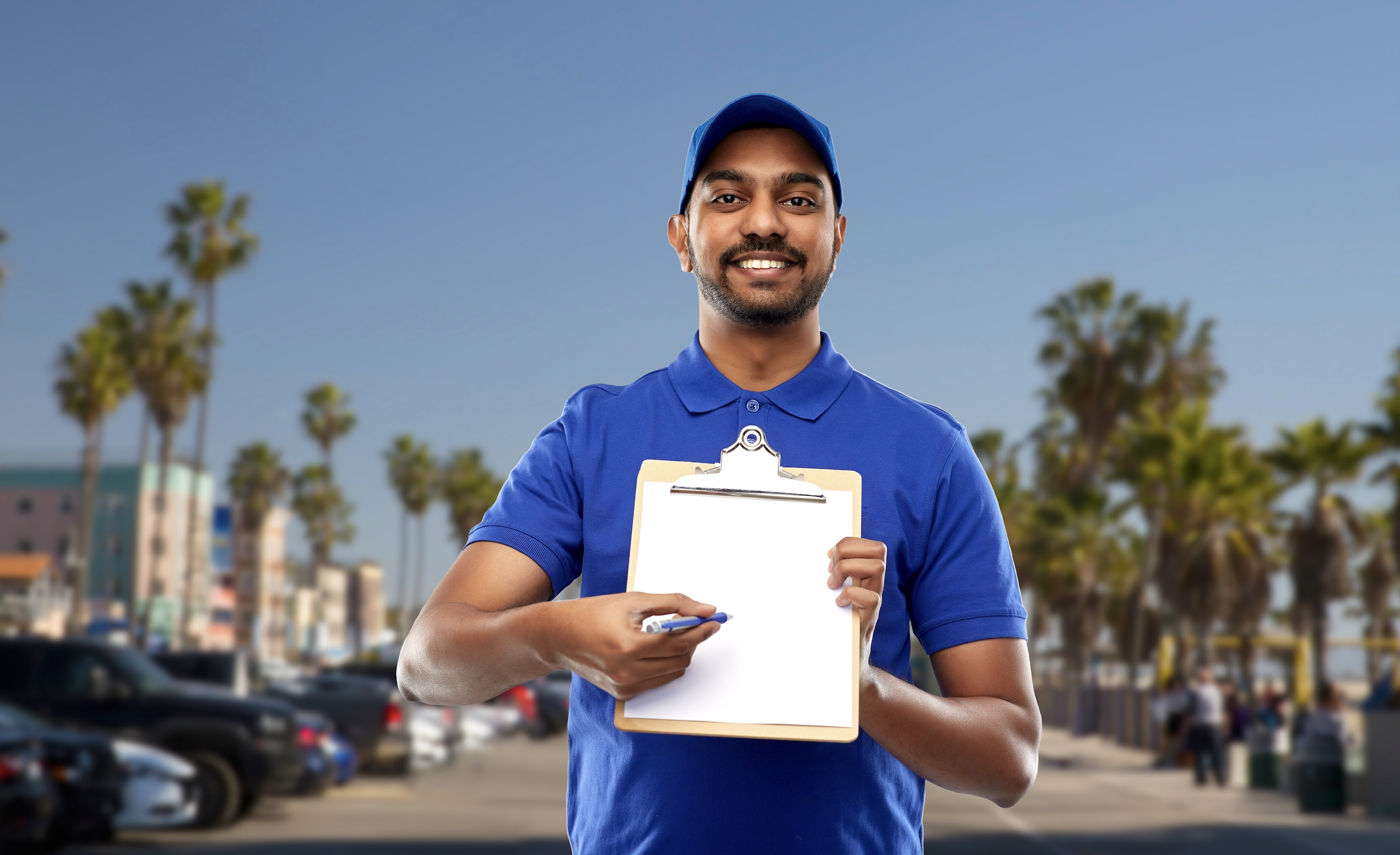 delivery driver with checklist and pen